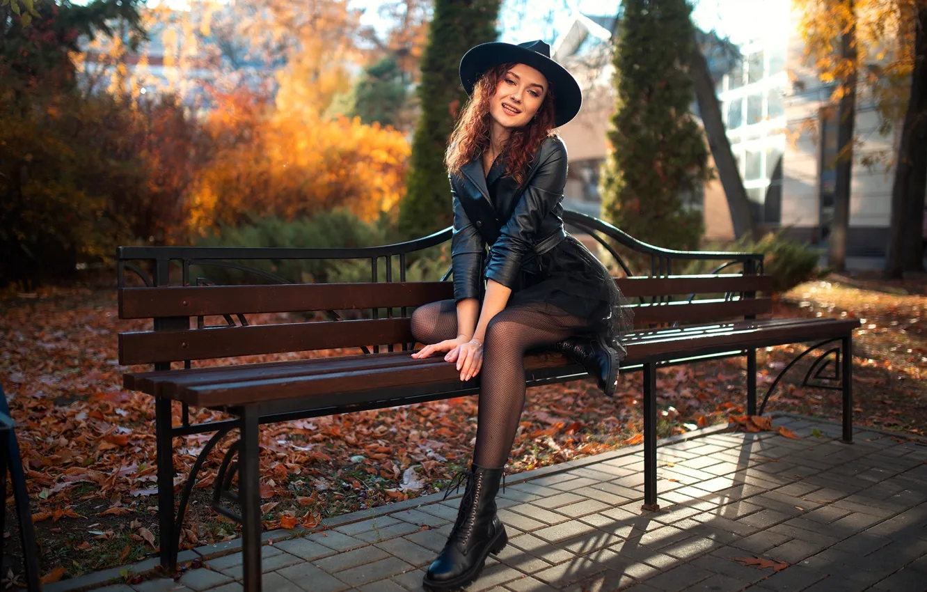 Photo wallpaper autumn, girl, bench, pose, smile, hat, fallen leaves, ankle boots