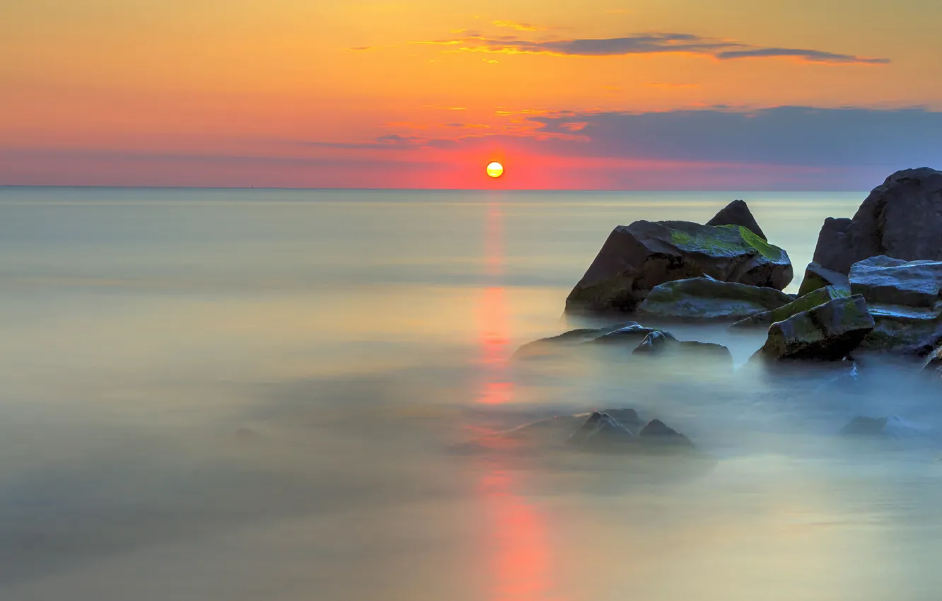 Photo wallpaper sea, clouds, reflection, sunrise, stones, horizon, orange sky, calm