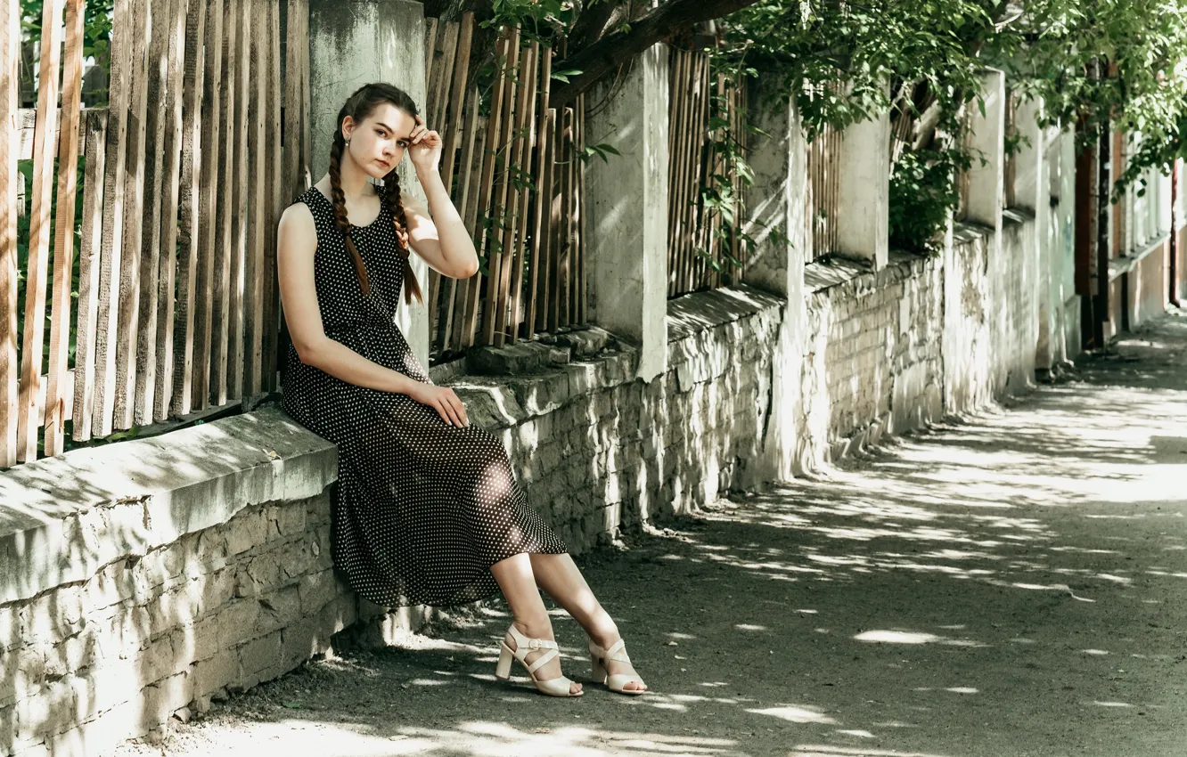 Photo wallpaper girl, street, the fence, sitting