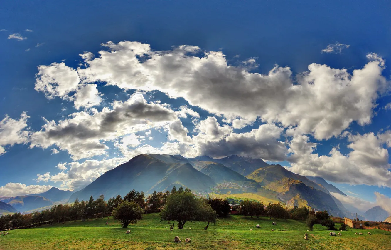 Photo wallpaper The sky, Clouds, Field, Mountains, Grass, Village, Clouds, Sky