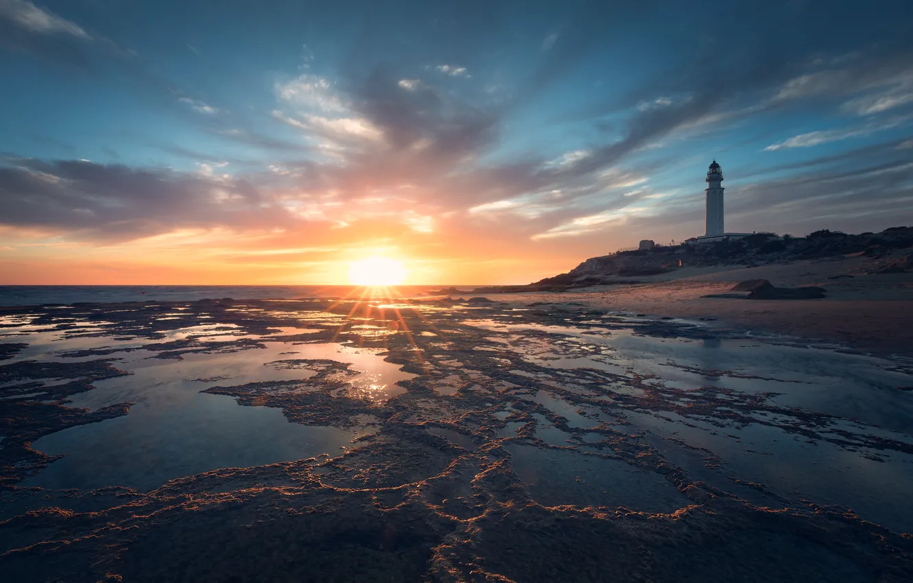 Photo wallpaper sea, the sun, clouds, light, sunset, shore, lighthouse, tower