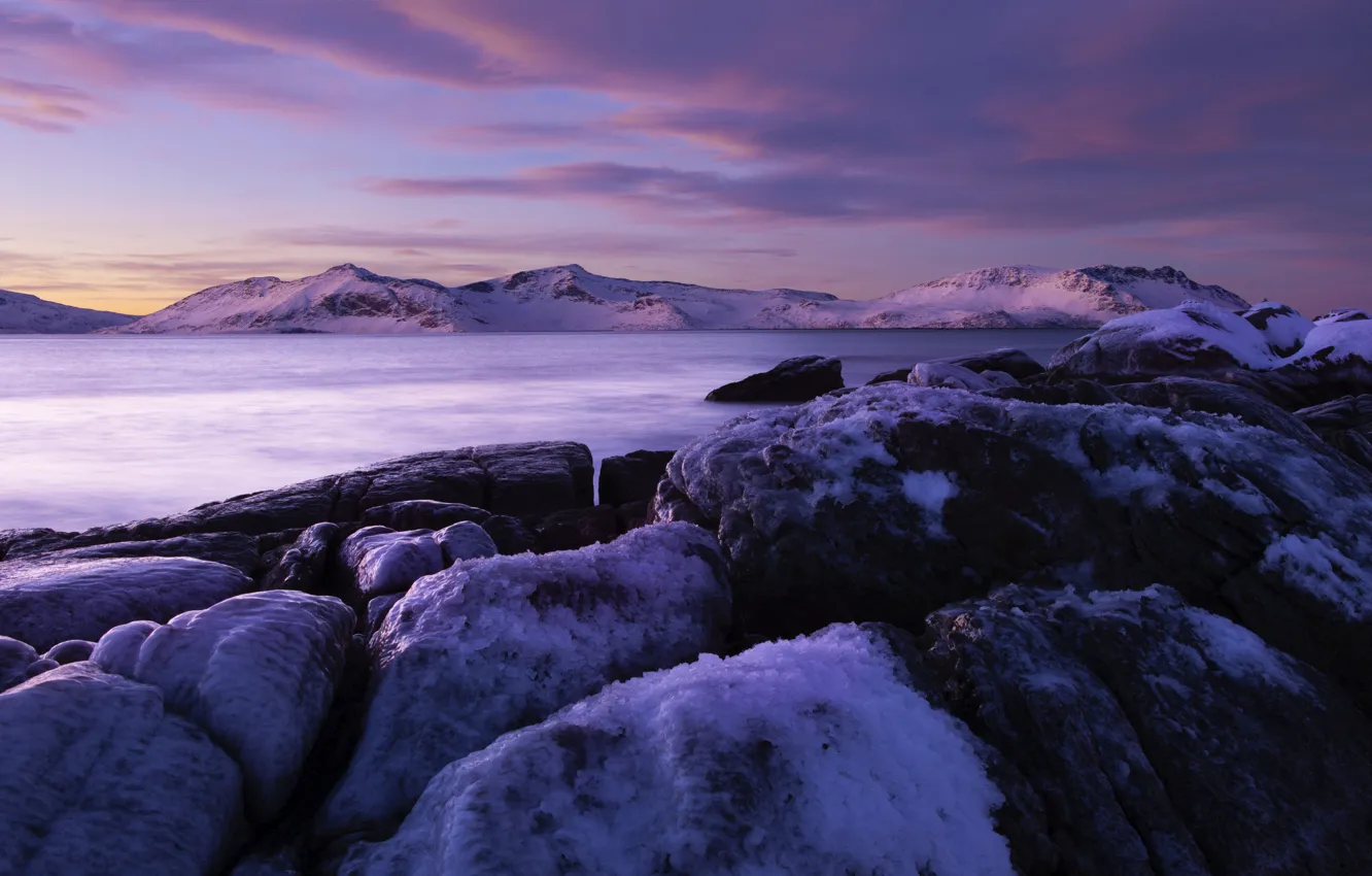 Photo wallpaper snow, mountains, winter, shore, pond, stones