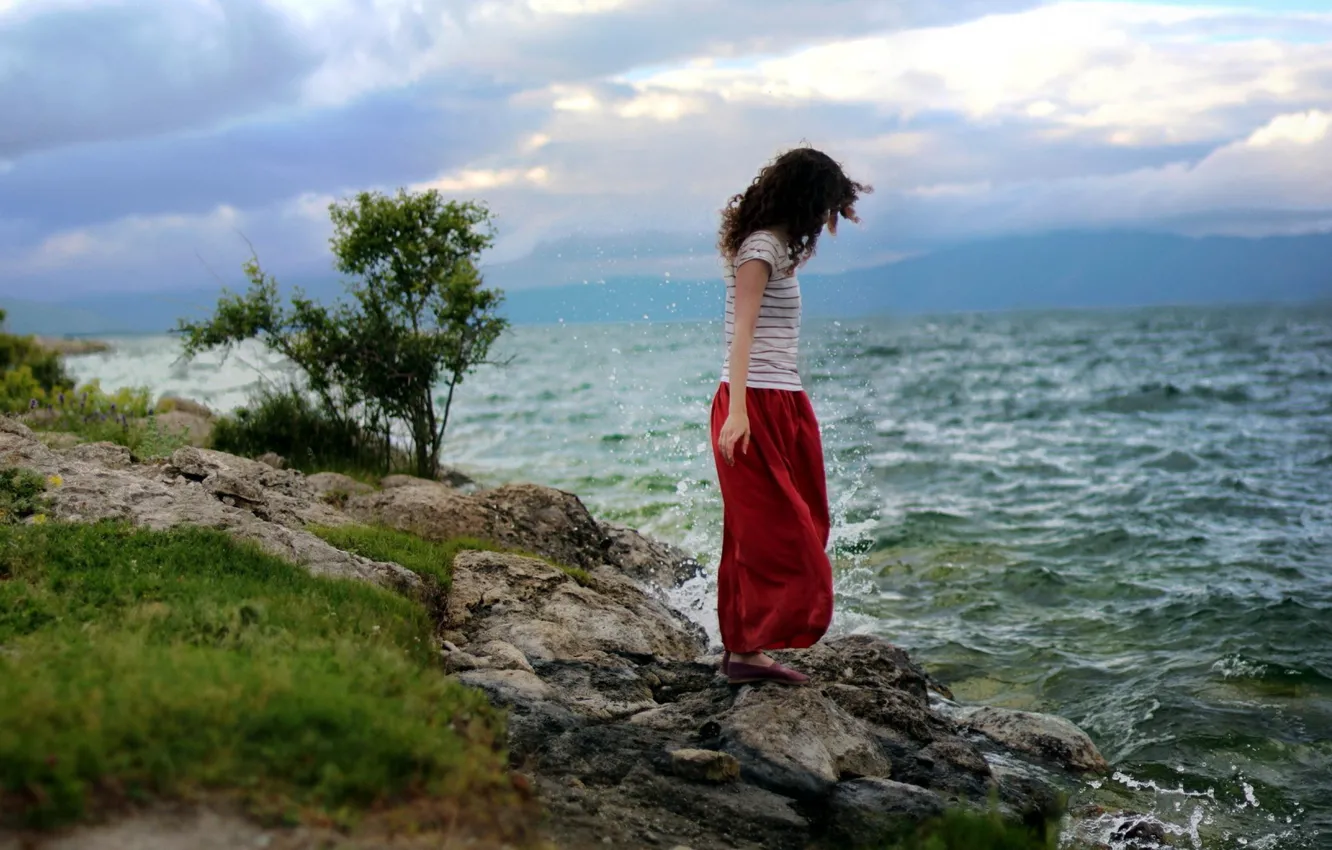 Photo wallpaper sea, wave, girl, stones, the wind, shore