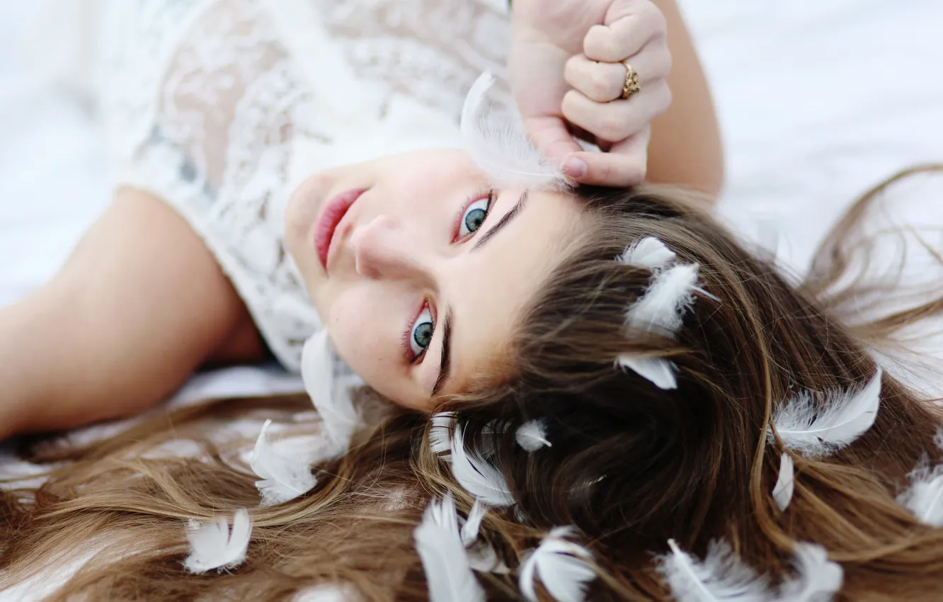 Photo wallpaper face, hair, feathers, brunette