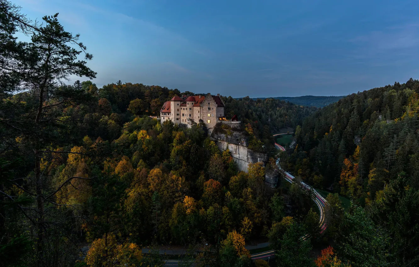 Photo wallpaper road, autumn, forest, the sky, trees, lights, castle, rocks