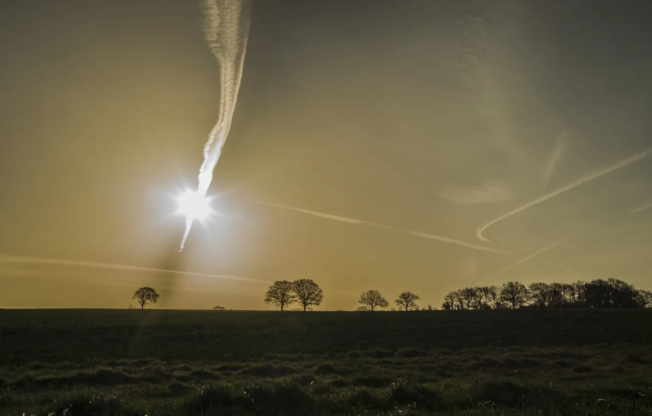 Photo wallpaper sunrise, silhouettes, crisscrossing contrails