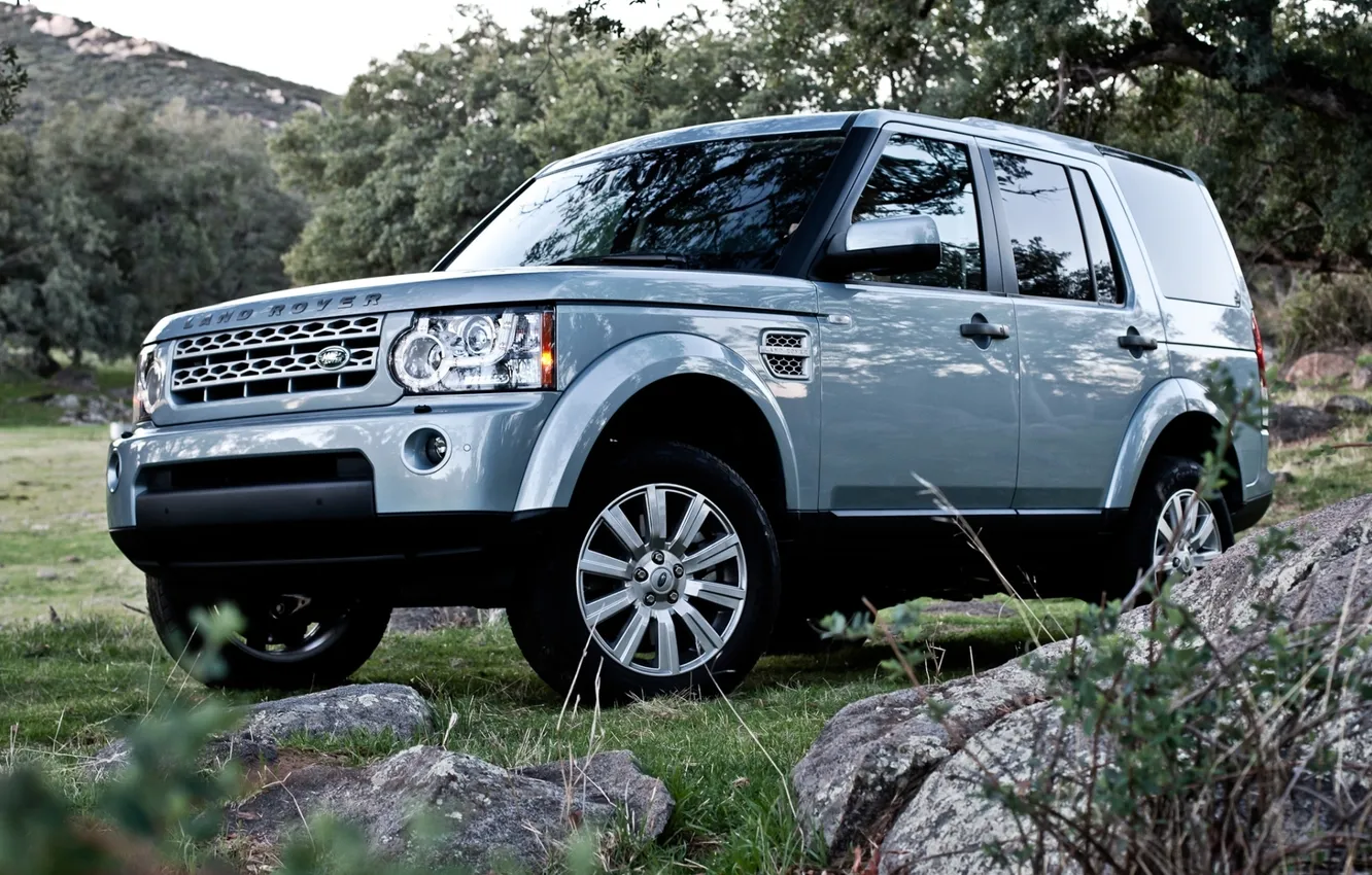 Photo wallpaper grass, trees, stones, jeep, SUV, Discovery, Land Rover, the front