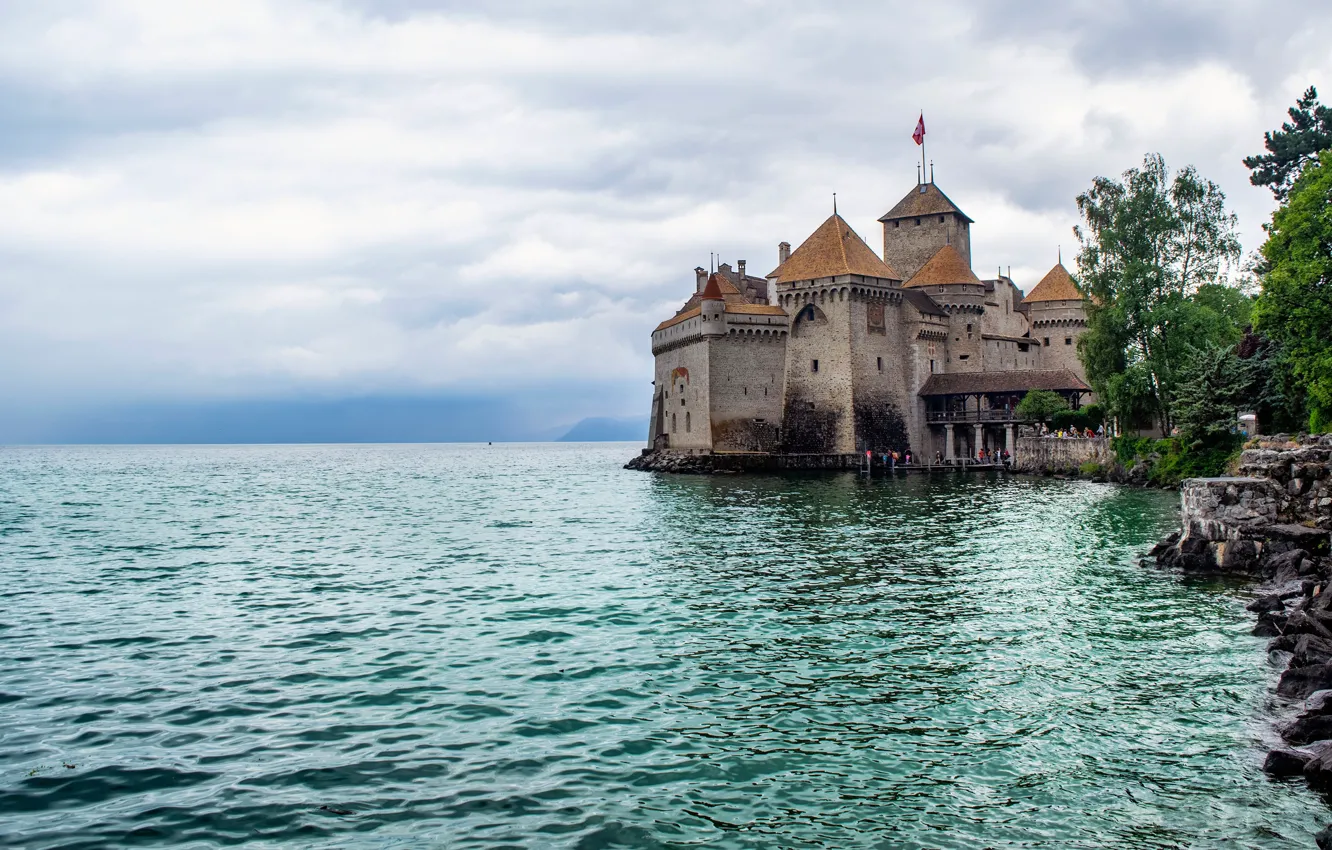 Photo wallpaper the sky, clouds, lake, stones, castle, shore, Switzerland, tower