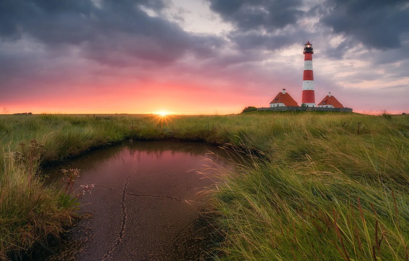 Photo wallpaper grass, water, the sun, clouds, light, lighthouse, home