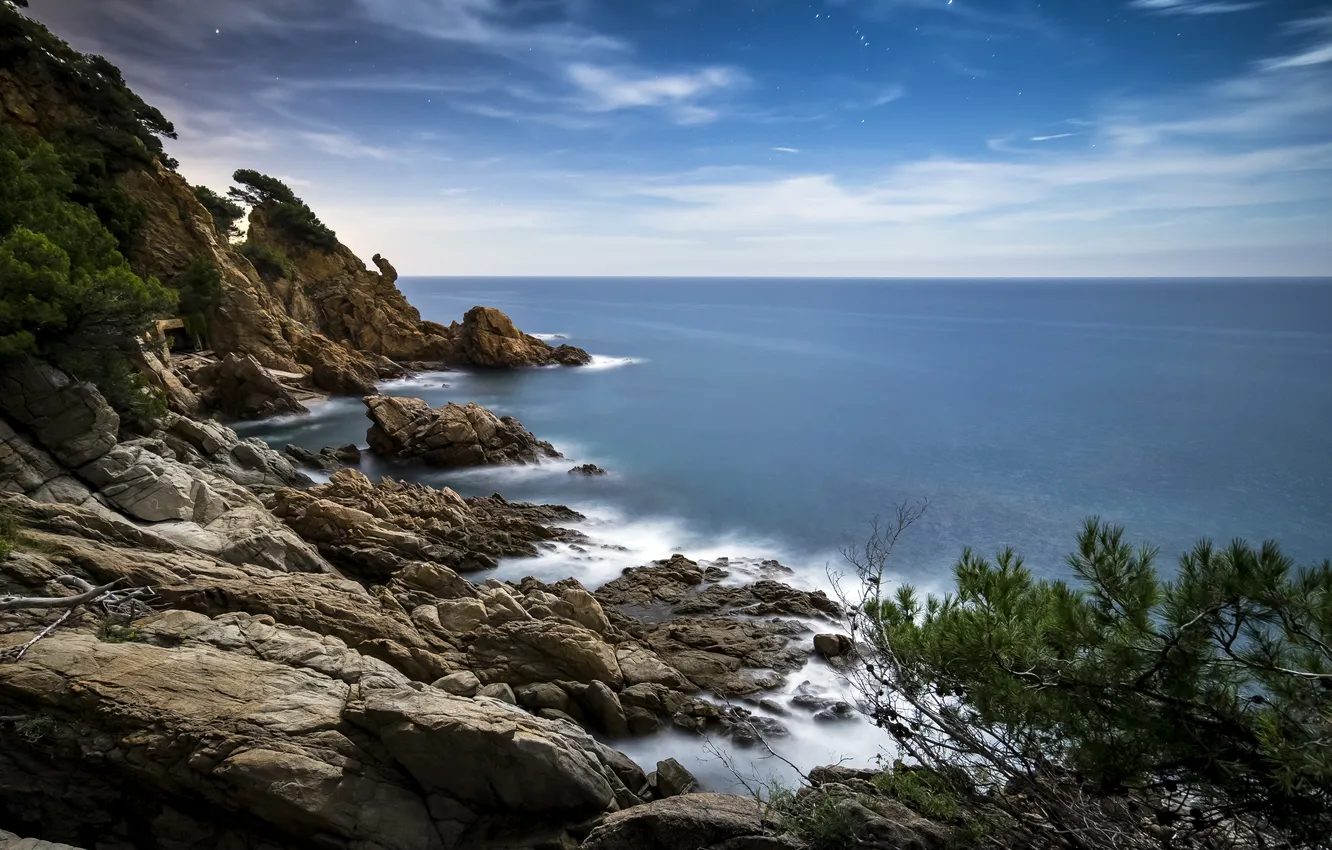 Photo wallpaper sea, the sky, clouds, stones, rocks, shore, horizon, Spain