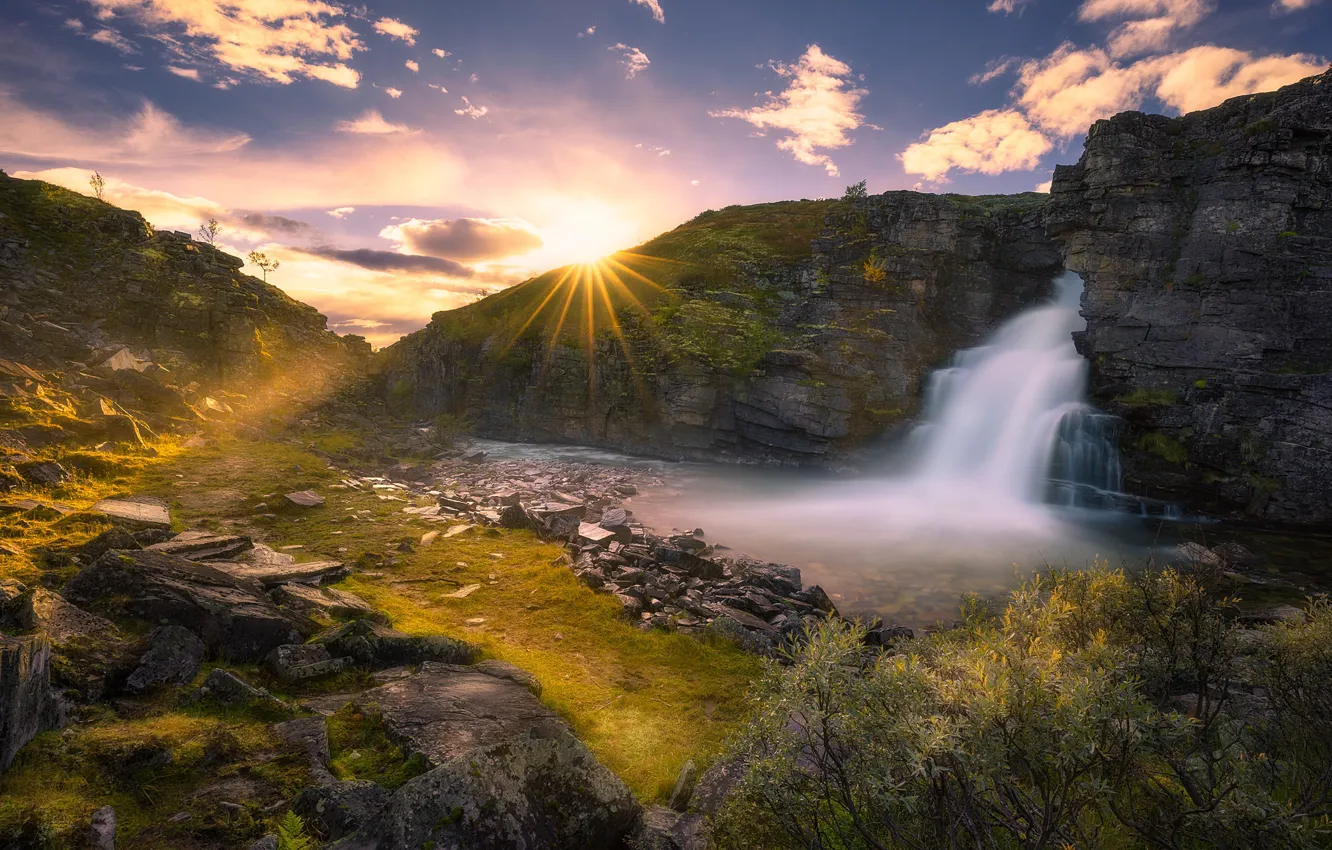 Photo wallpaper the sky, clouds, stones, rocks, waterfall, Norway, the rays of the sun, the bushes
