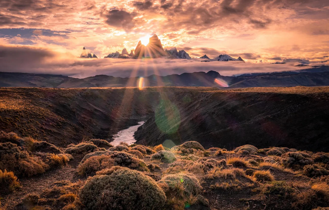 Photo wallpaper the sun, clouds, rays, light, sunset, mountains, fog, glare