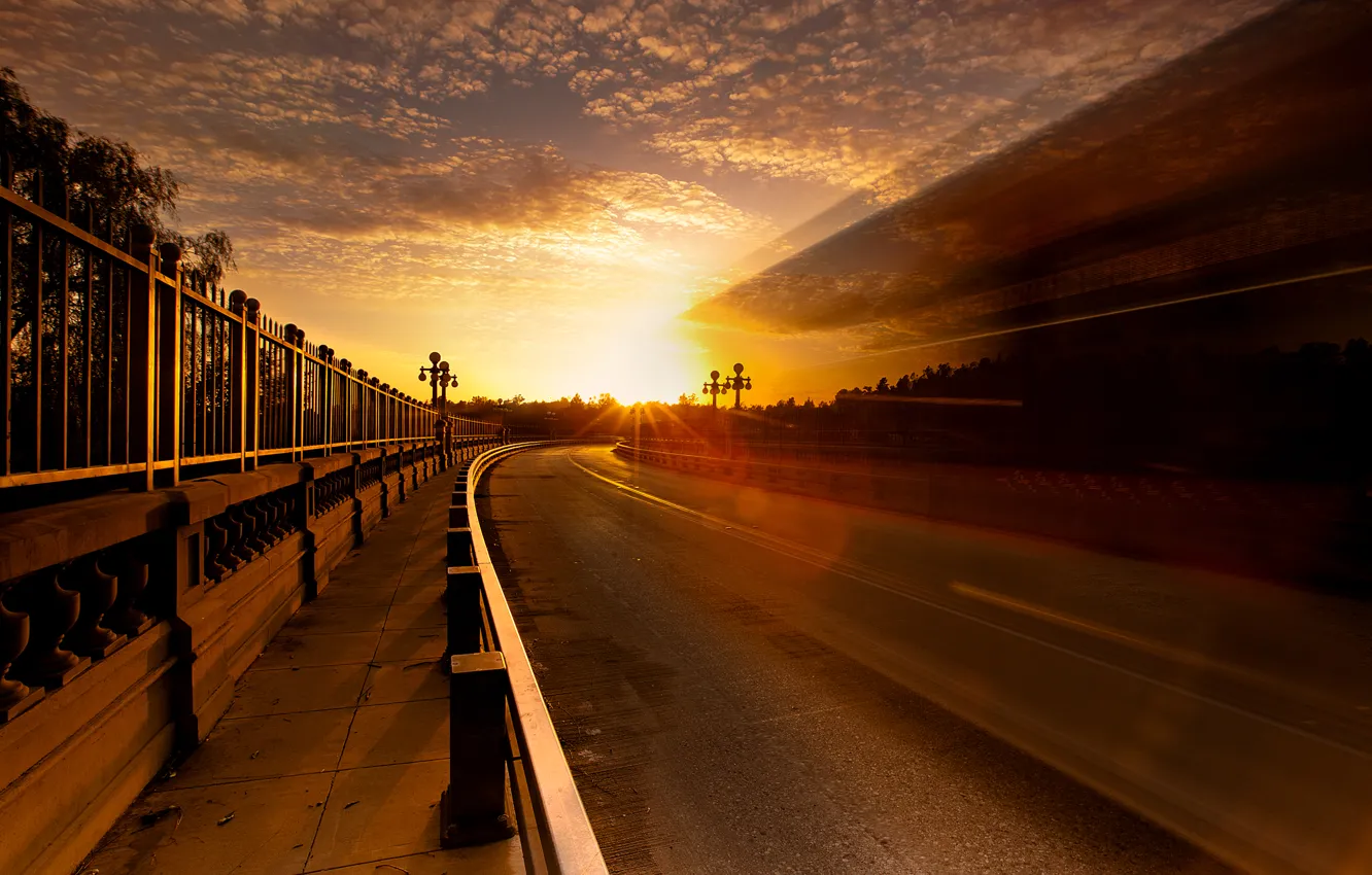 Photo wallpaper road, the sky, the sun, light, the city, glare, the fence, excerpt