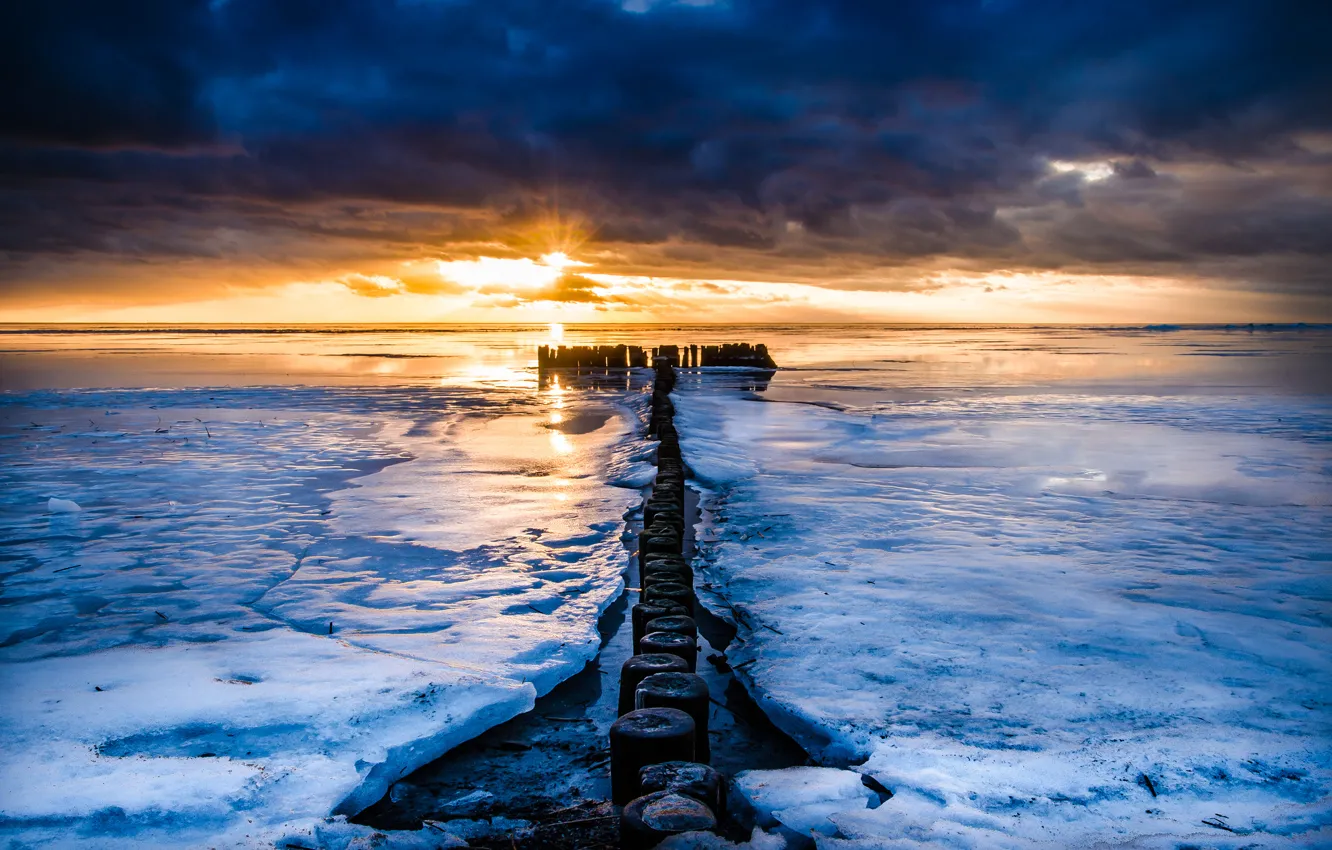 Photo wallpaper sea, sunset, ice, piles