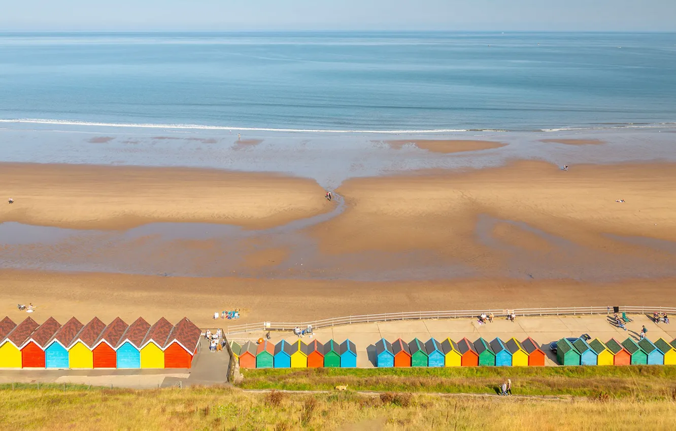 Photo wallpaper beach, the ocean, England, tide, North Yorkshire, North Yorkshire, golden sands and colorful huts of …