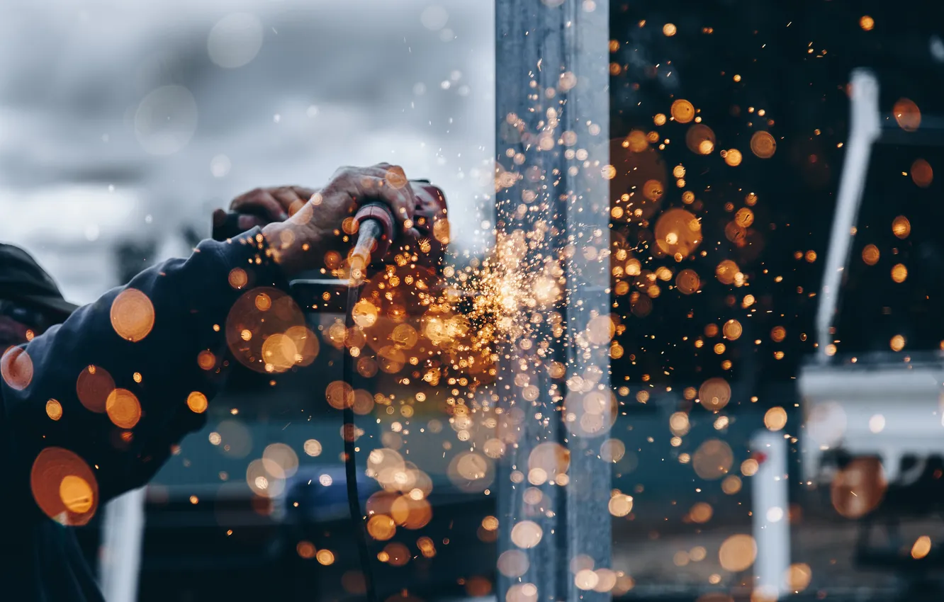 Photo wallpaper hand, sparks, grinder, worker