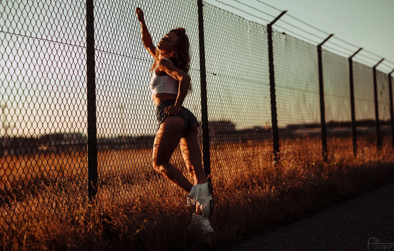Photo wallpaper field, grass, girl, the sun, sexy, pose, model, the fence