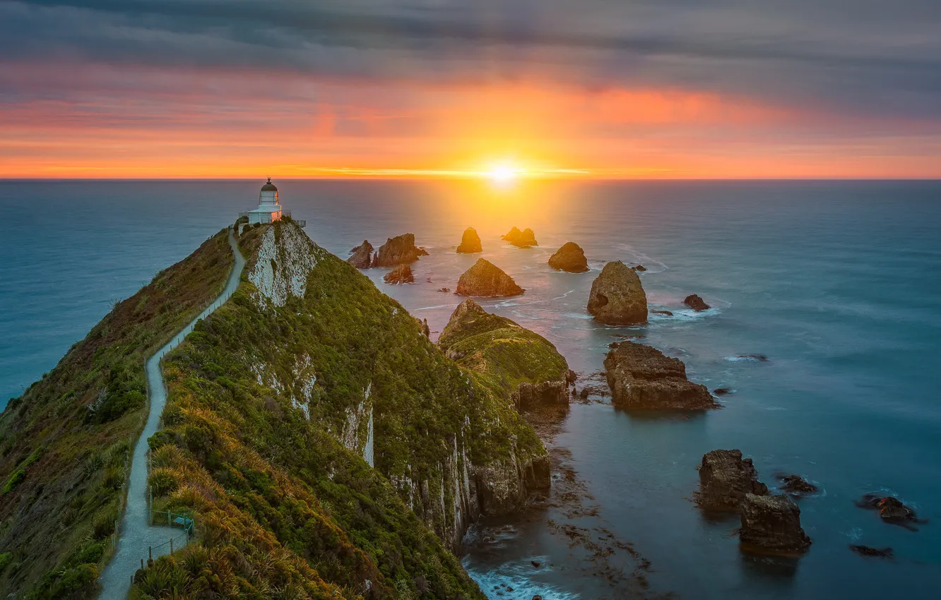 Photo wallpaper sunrise, the ocean, rocks, dawn, coast, lighthouse, morning, New Zealand