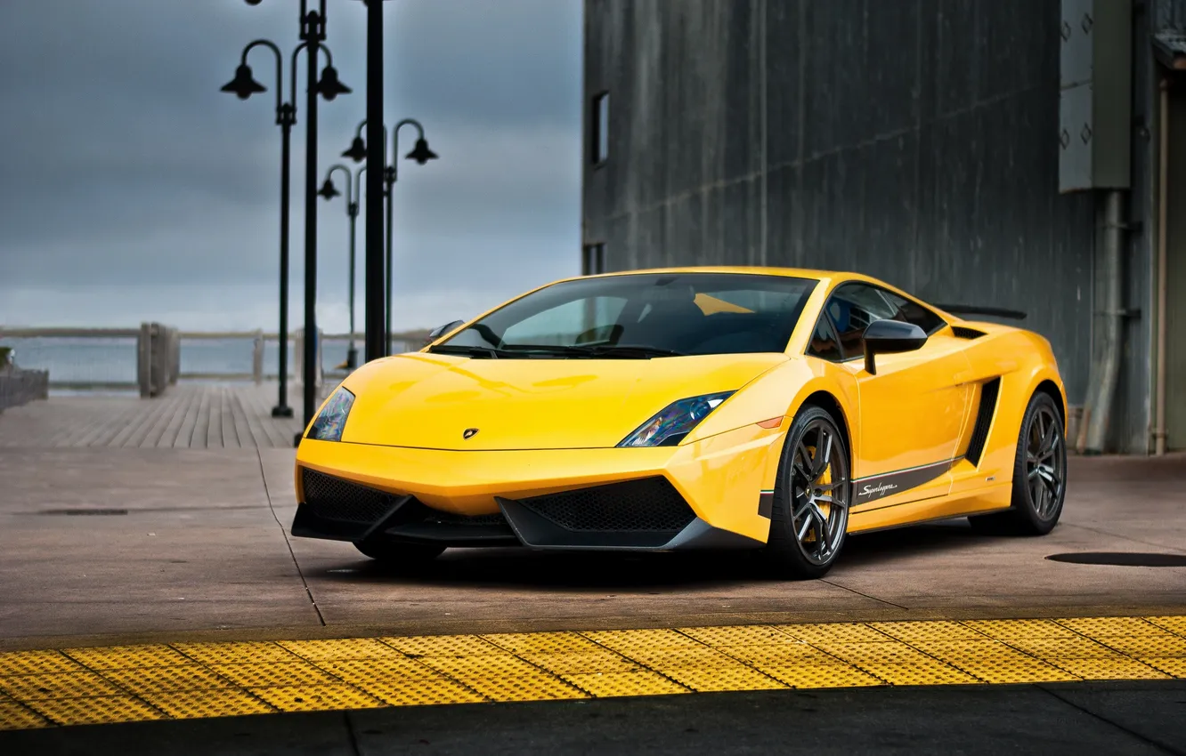 Photo wallpaper the sky, yellow, clouds, grey, building, Lamborghini, lights, promenade