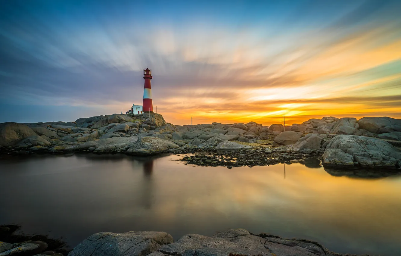 Photo wallpaper sea, the sky, clouds, stones, rocks, lighthouse, glow, Cape