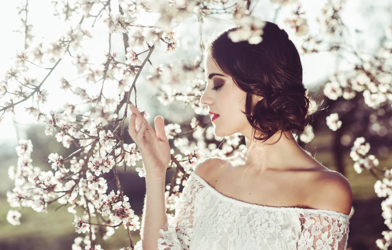 Photo wallpaper girl, light, trees, flowers, branches, face, cherry, pose