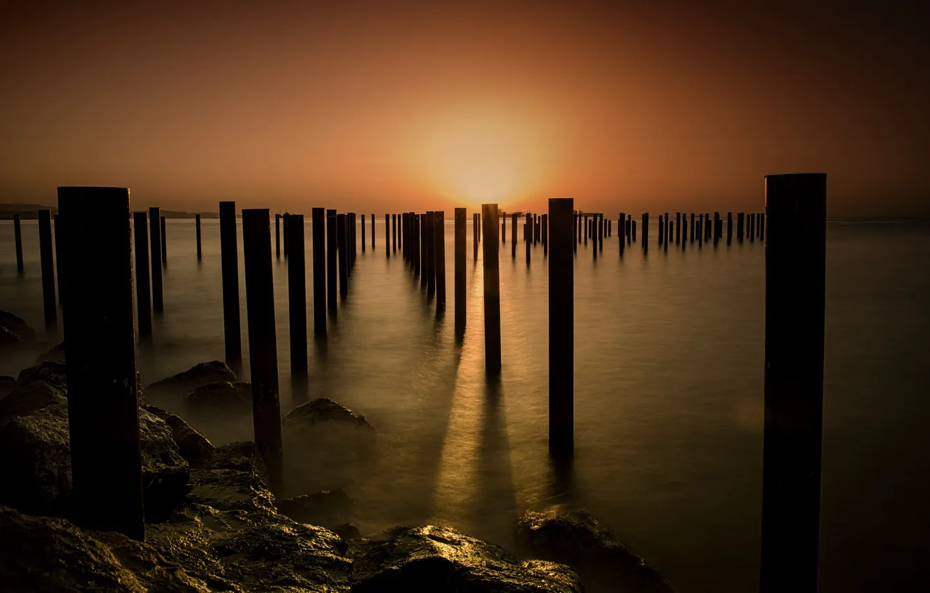 Photo wallpaper sea, sunset, shore, posts