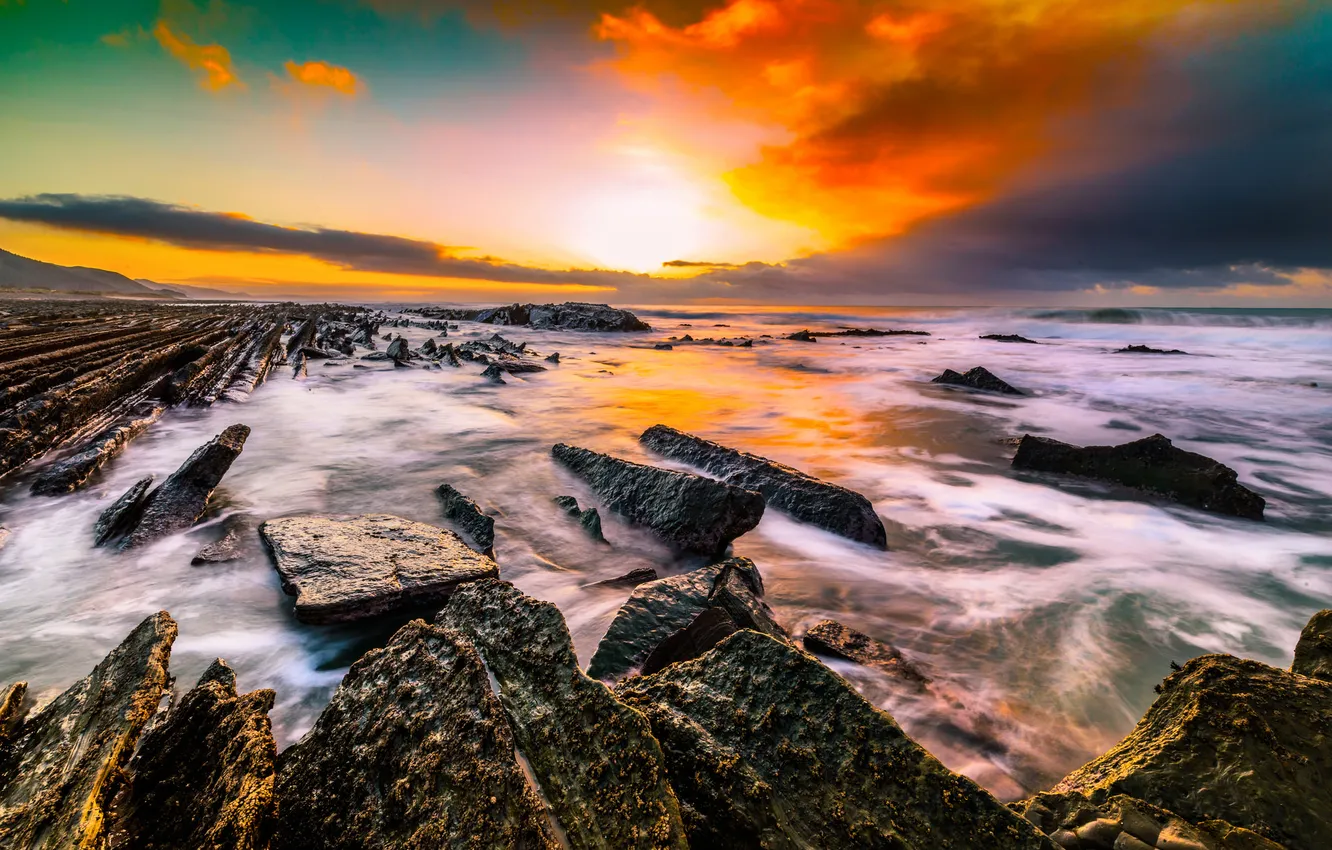 Photo wallpaper sea, the sky, clouds, sunset, squirt, stones, rocks, paint
