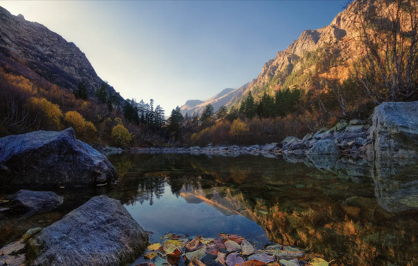 Photo wallpaper autumn, leaves, trees, mountains, lake, stones, Bank, boulders