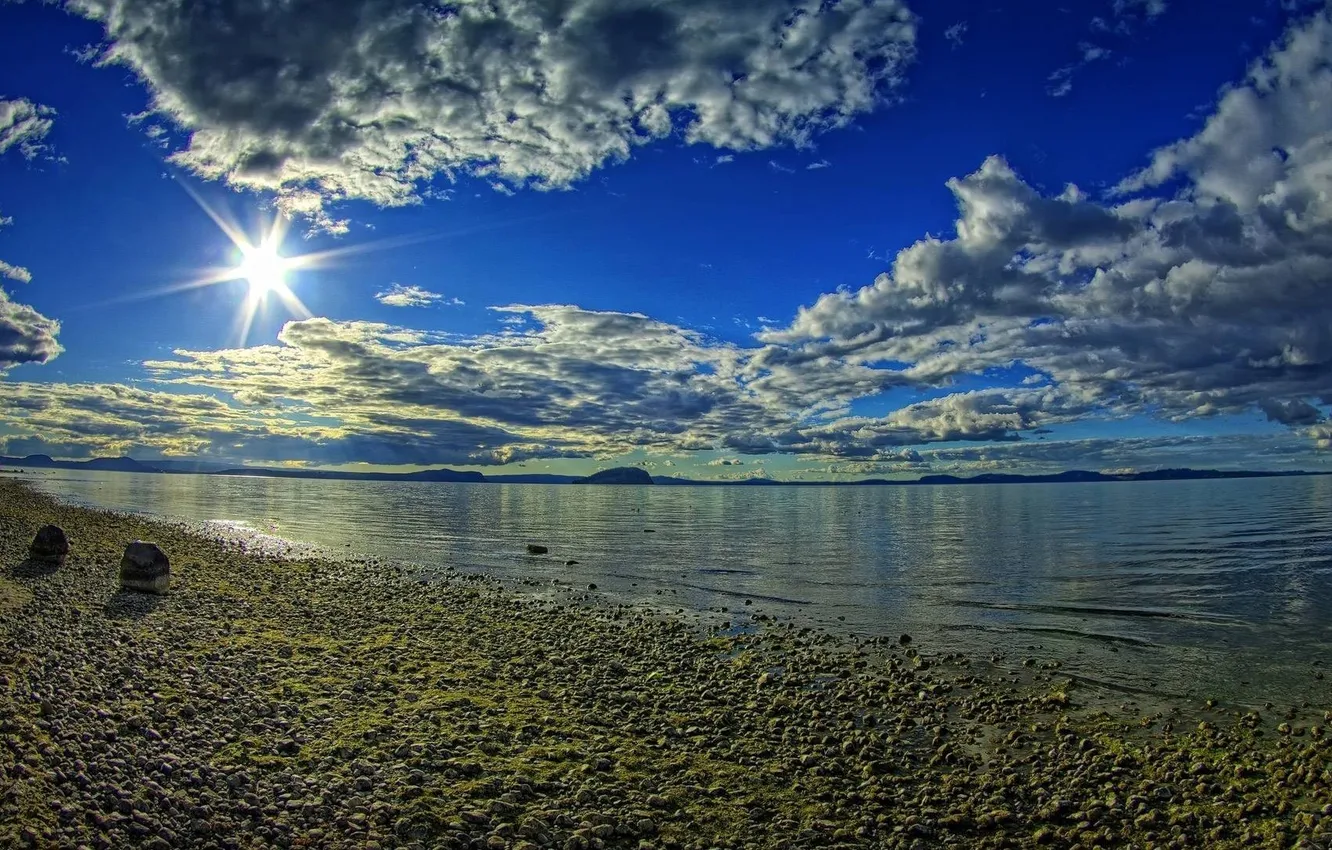 Photo wallpaper sea, the sky, the sun, clouds, rays, light, mountains, stones