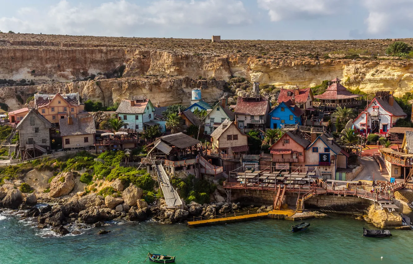 Photo wallpaper sea, stones, rocks, shore, boat, pier, village, house
