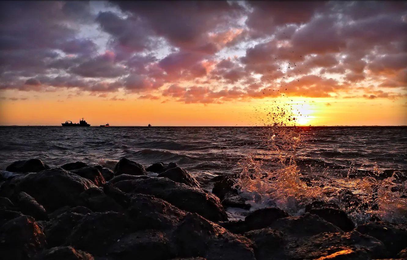 Photo wallpaper sea, wave, sunset, squirt, stones, shore, splash