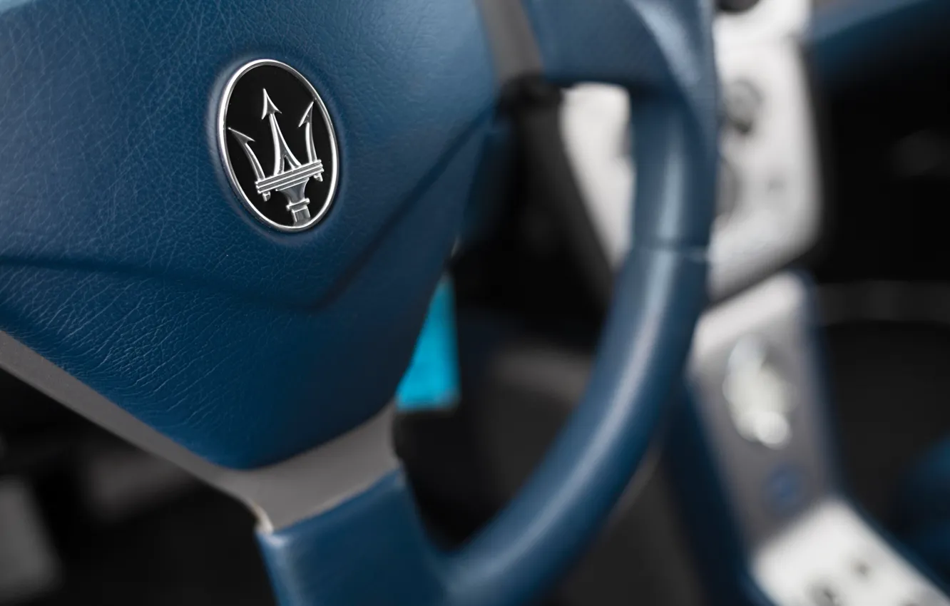 Photo wallpaper Maserati, logo, MC12, Maserati MC12, steering wheel, badge