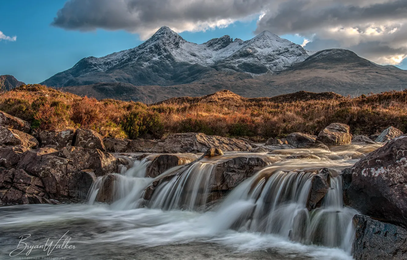 Photo wallpaper the sky, grass, the sun, clouds, mountains, stream, stones, waterfall