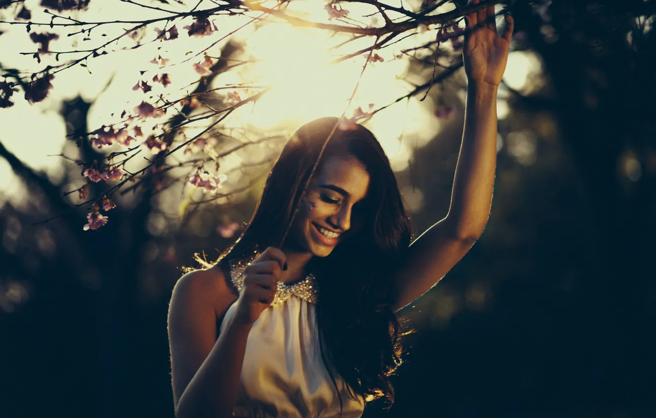 Photo wallpaper girl, smile, flowers, tree, hair, sunlight, branches, joy