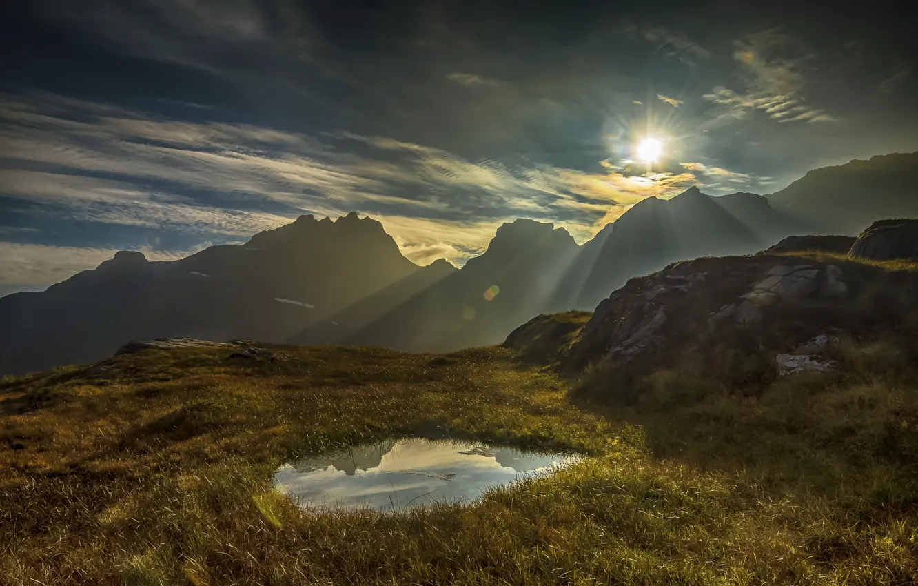 Photo wallpaper the sky, grass, water, the sun, clouds, rays, sunset, mountains