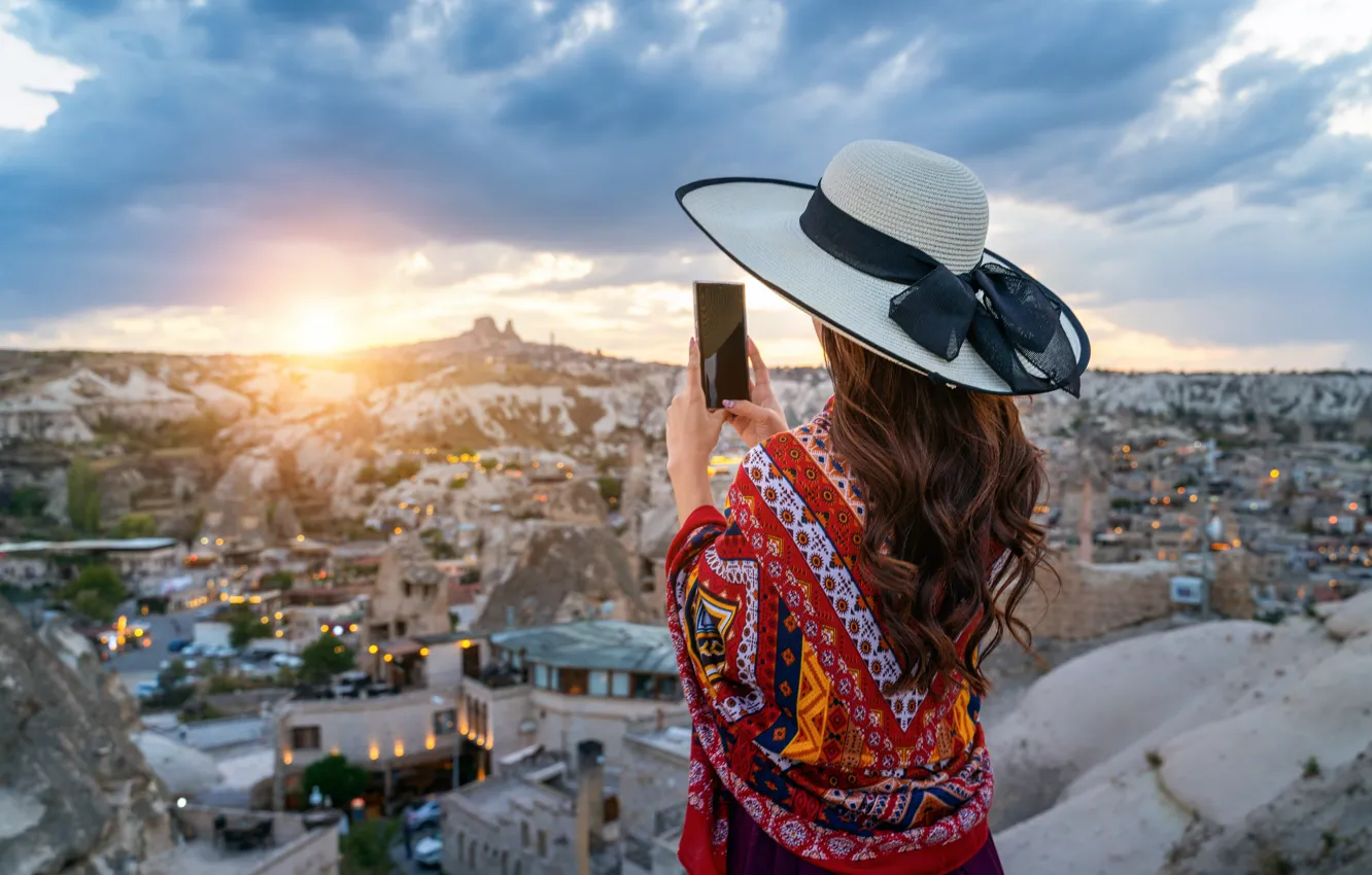 Photo wallpaper girl, the city, hat, Turkey, smartphone, Cappadocia