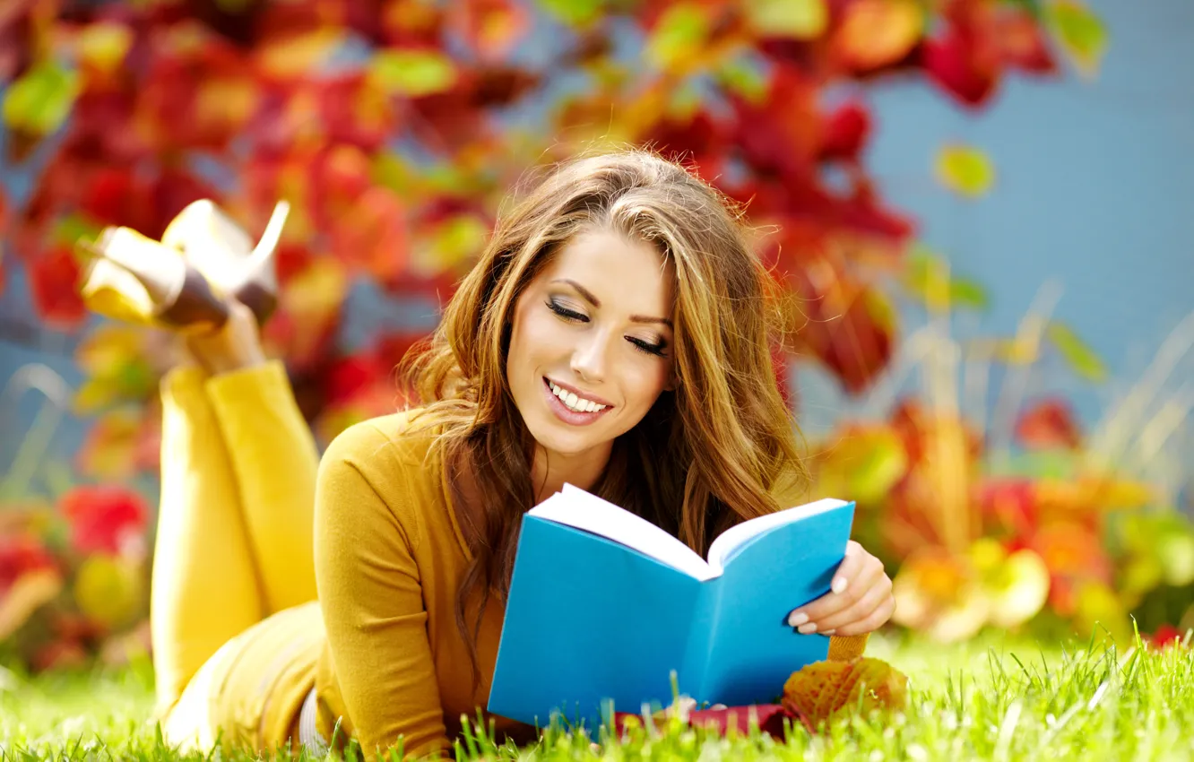 Photo wallpaper autumn, grass, leaves, girl, smile, book, brown hair, reads