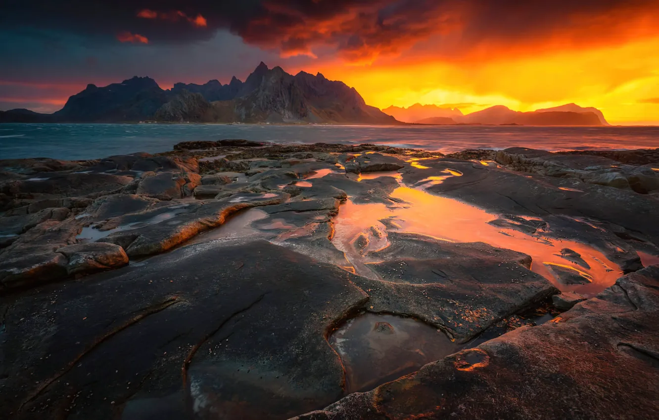 Photo wallpaper sunset, mountains, pond, rocky shore