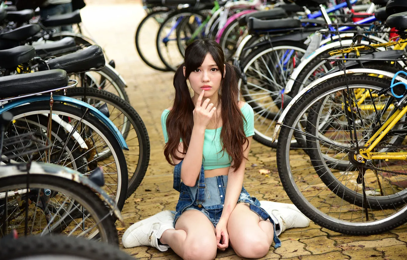 Photo wallpaper girl, bike, face, model, hair, braids, sitting