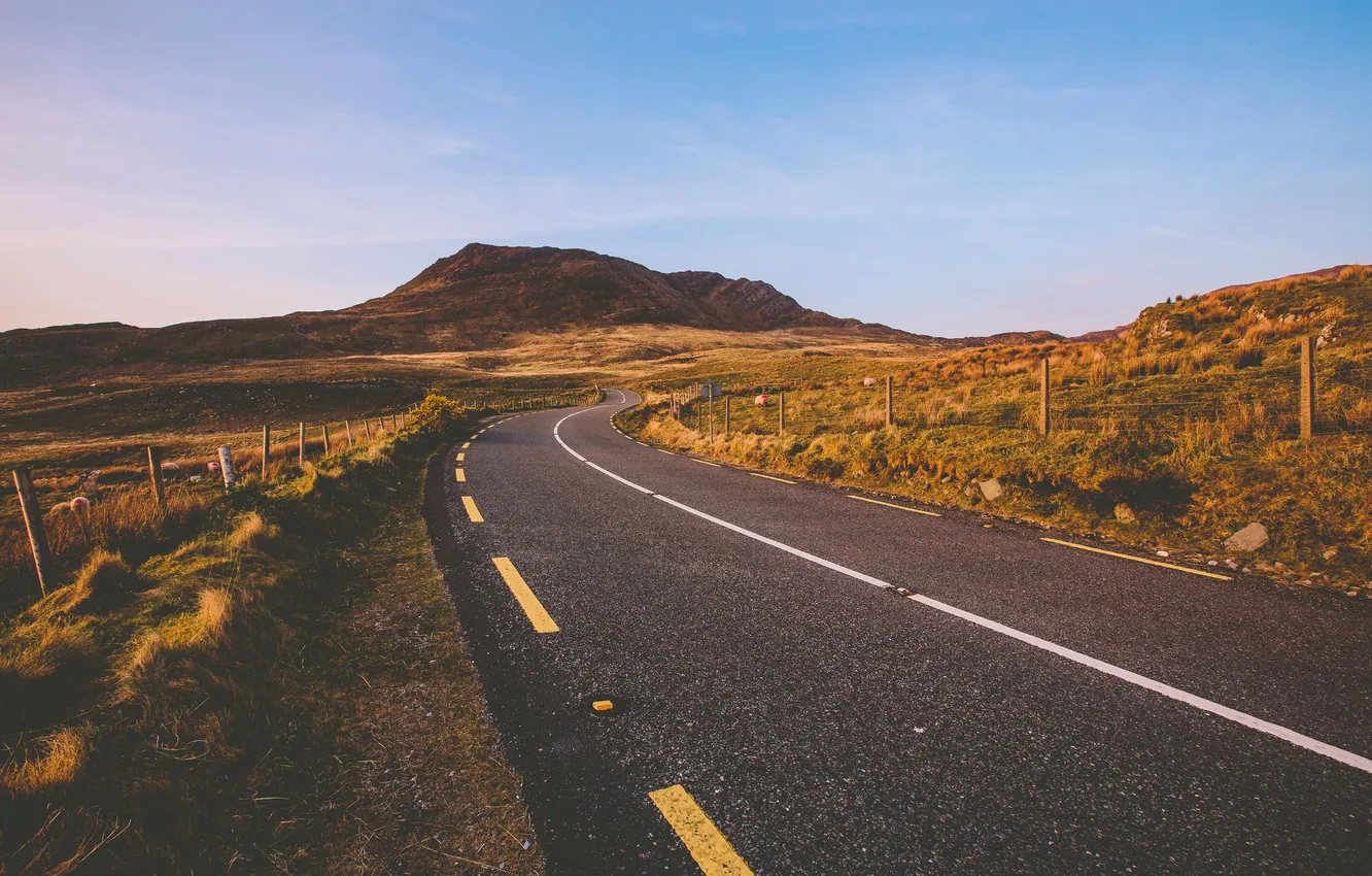 Photo wallpaper road, field, the sky, mountains, the fence, pack, the countryside