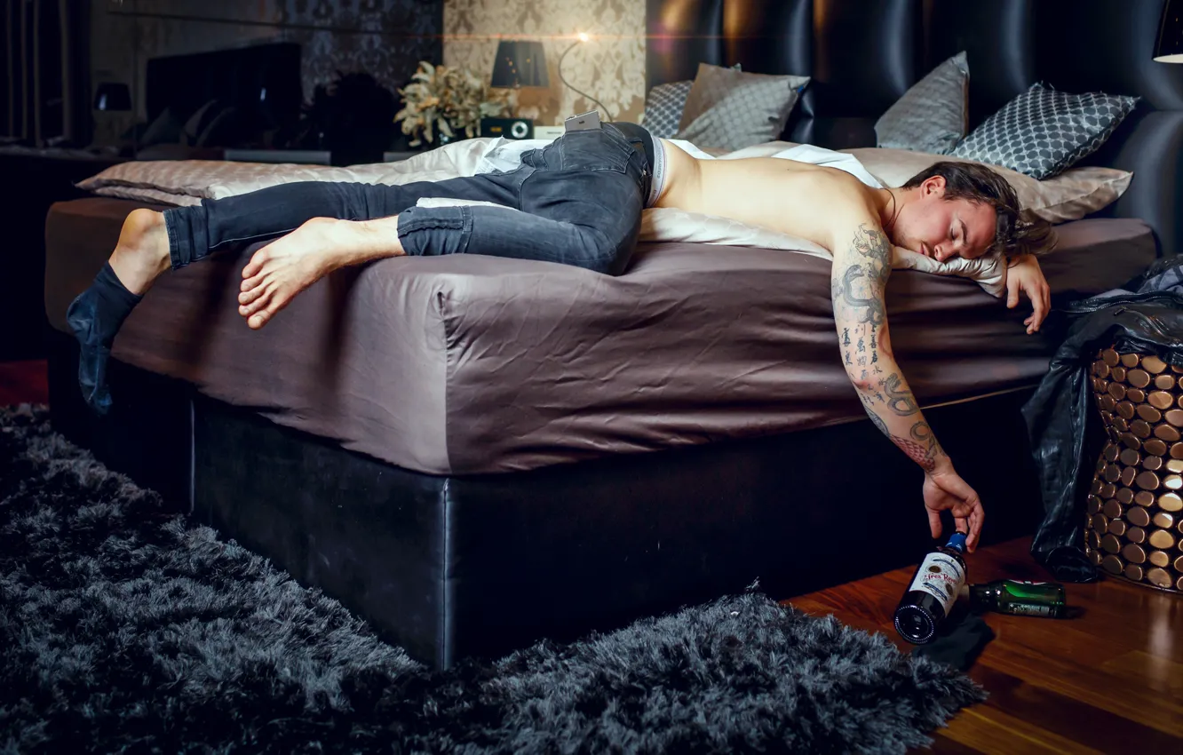 Photo wallpaper bottle, bed, man, the situation, jeans, tattoo, sleeping, drunk