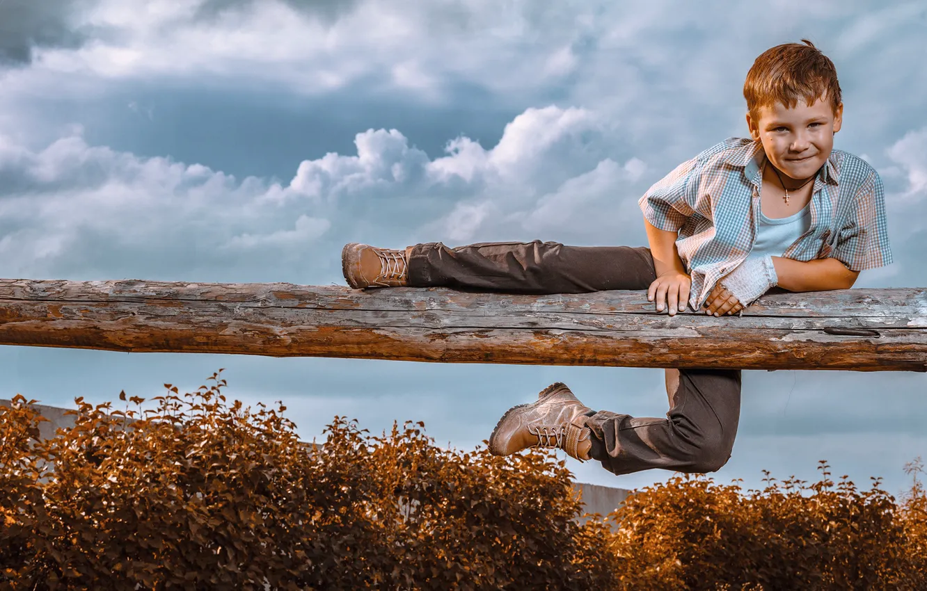 Photo wallpaper the sky, clouds, children, boy, log, the bushes, ginger, naughty