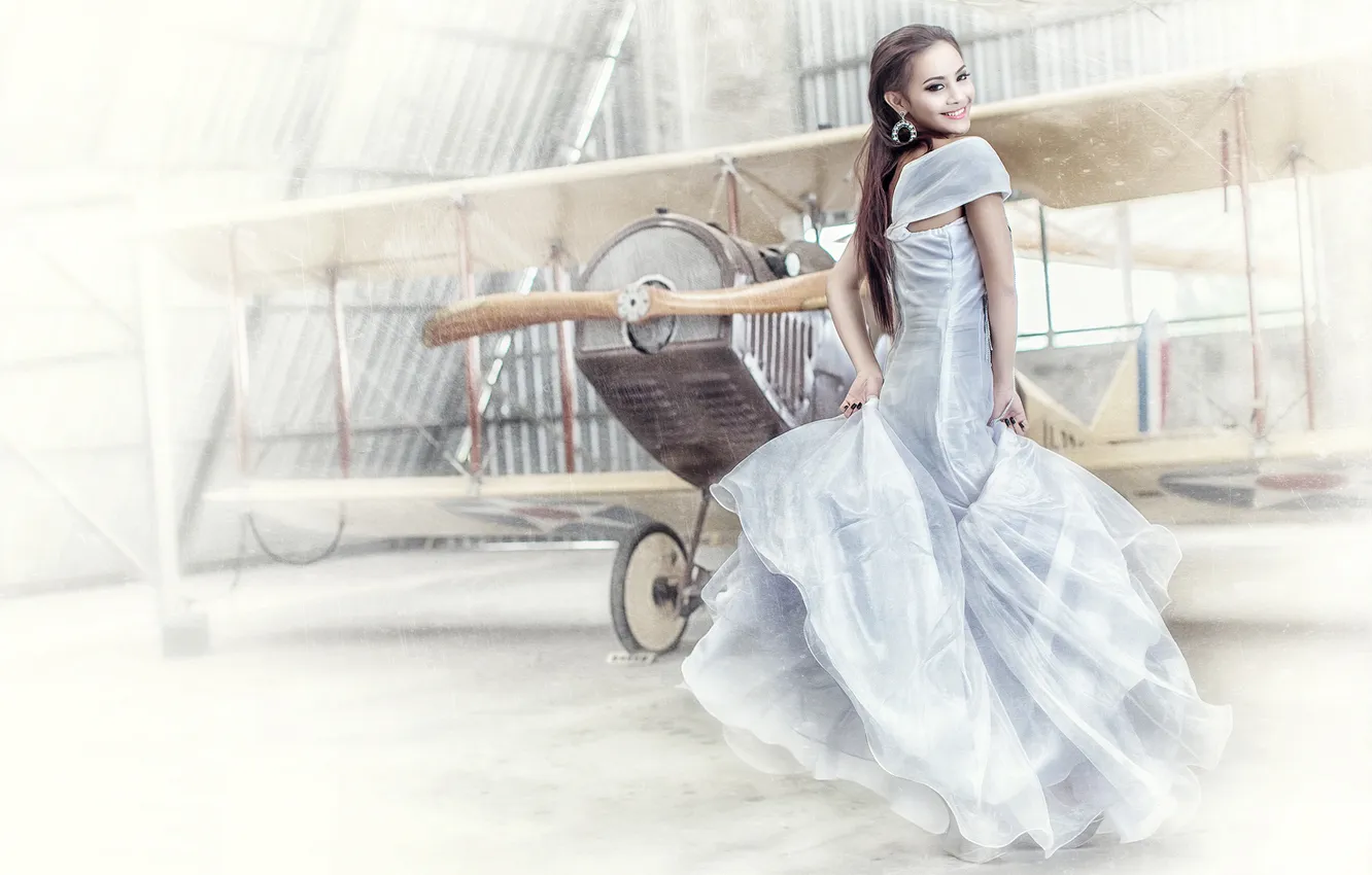 Photo wallpaper girl, smile, the plane, background, dress, hangar, biplane