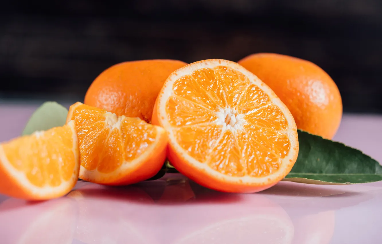 Photo wallpaper leaves, macro, table, orange, fruit, black background, slices, bokeh