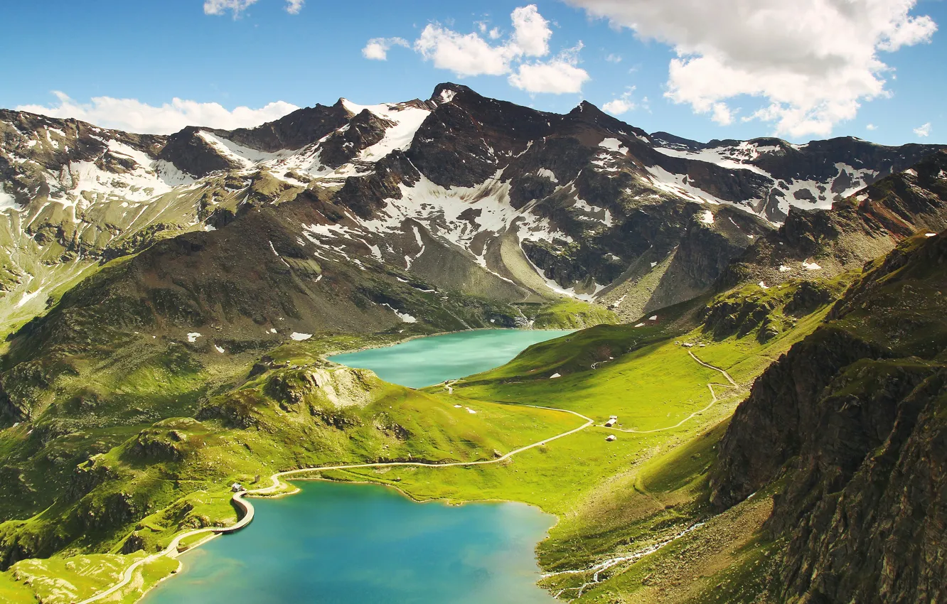 Photo wallpaper road, clouds, snow, mountains, green, lake, rocks, tops