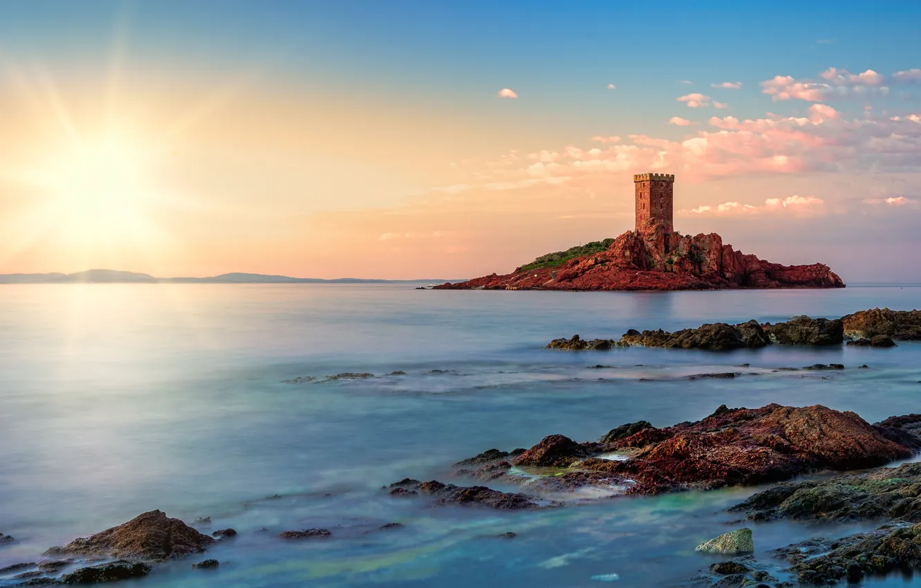 Photo wallpaper the sun, rays, stones, castle, rocks, shore, tower, ruins