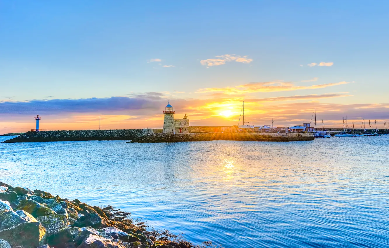 Photo wallpaper sea, the sky, the sun, clouds, rays, sunset, stones, lighthouse