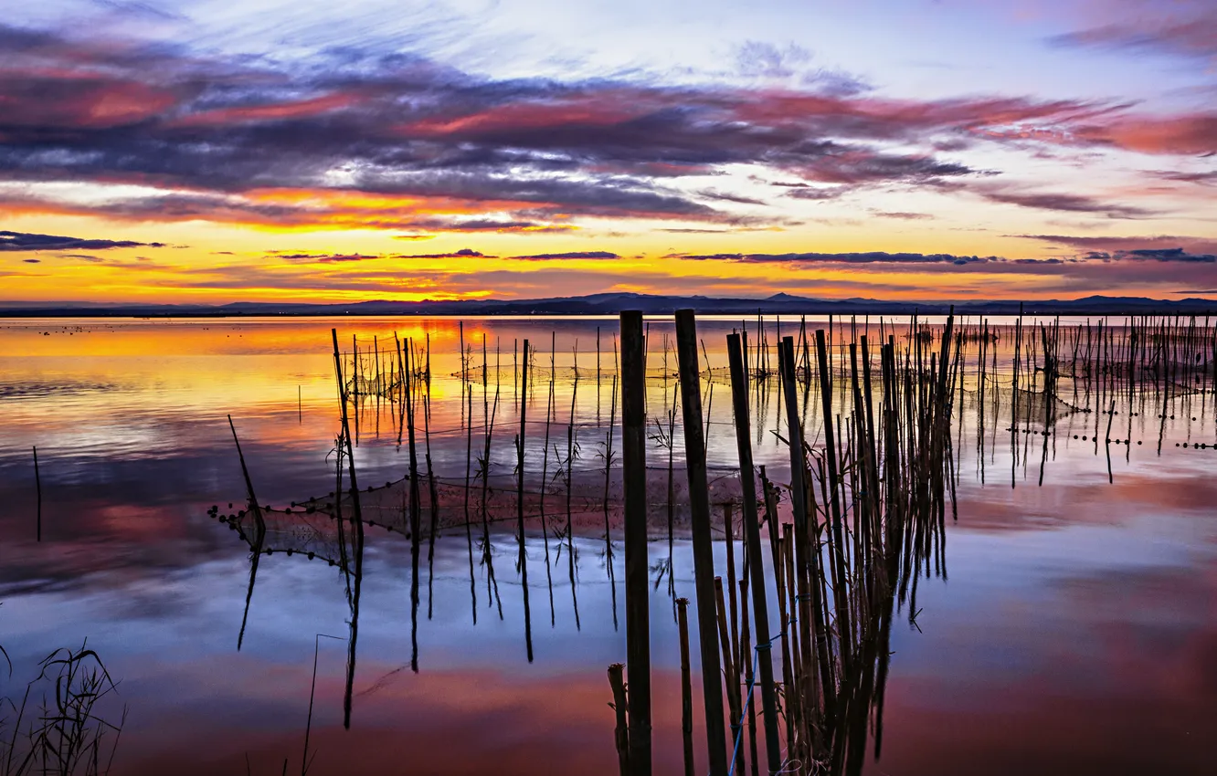 Photo wallpaper clouds, sunset, lake, reflection, posts, mirror, fishnet