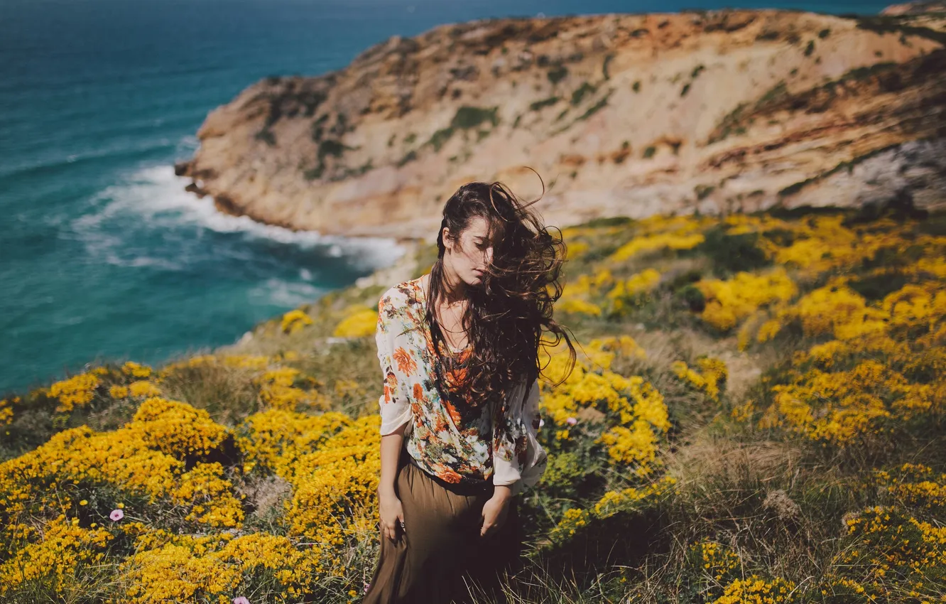 Photo wallpaper sea, wave, girl, flowers, rocks, the wind, hair, blouse