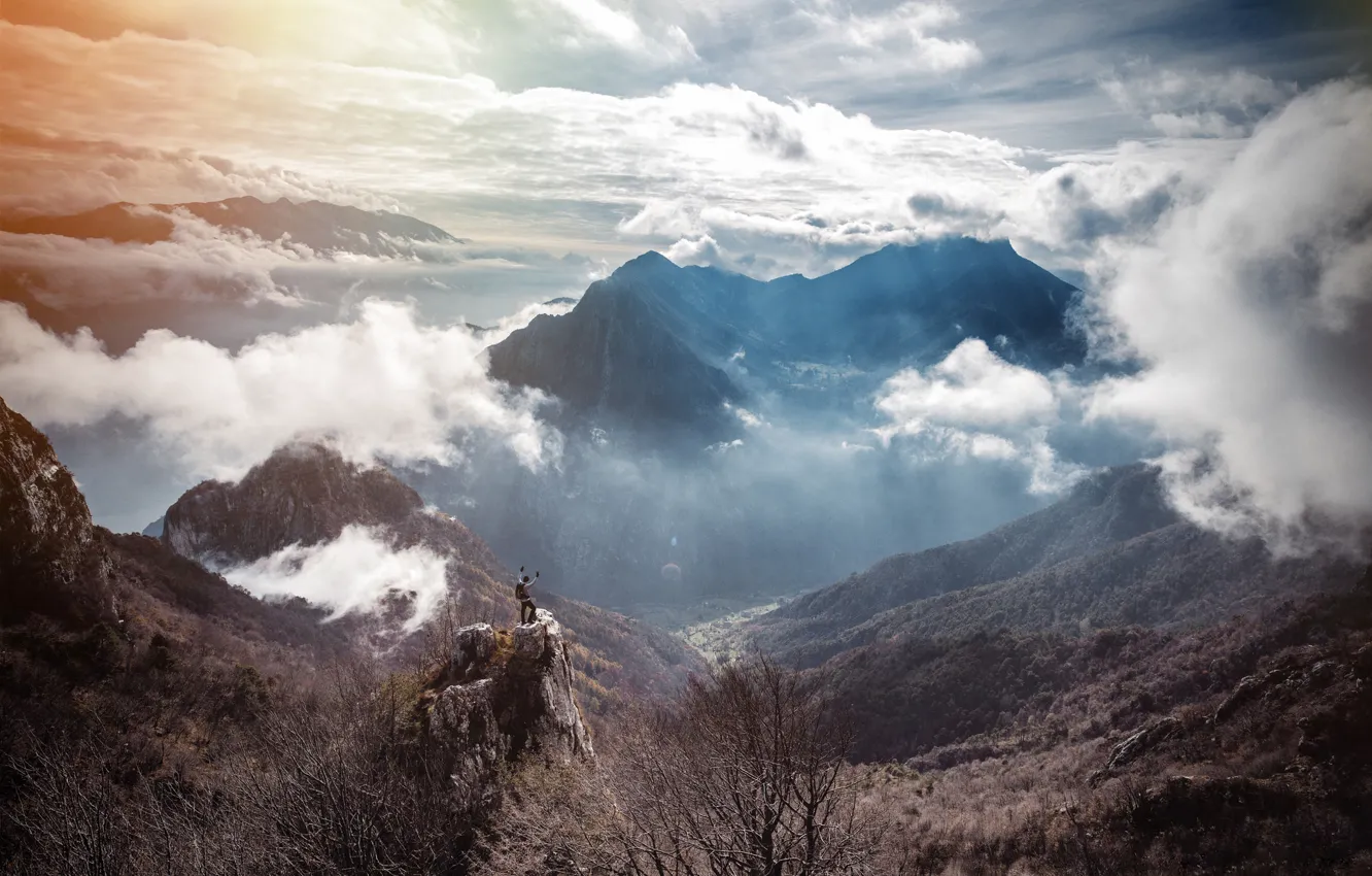 Photo wallpaper the sun, clouds, mountains, valley, male, adventure